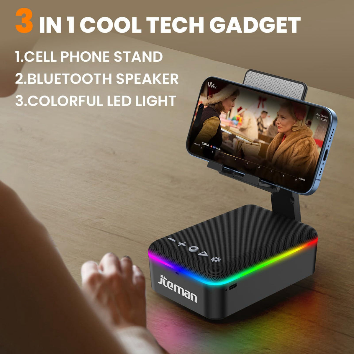 3-in-1 cool tech gadget with phone stand, Bluetooth speaker, and colorful LED light on a wooden surface.