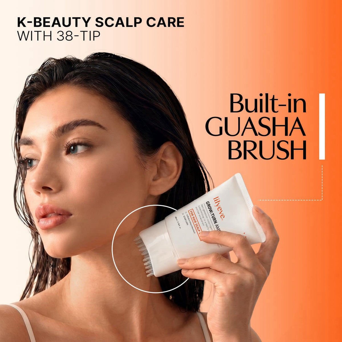 Woman using a K-beauty scalp care product with a built-in guasha brush on an orange background