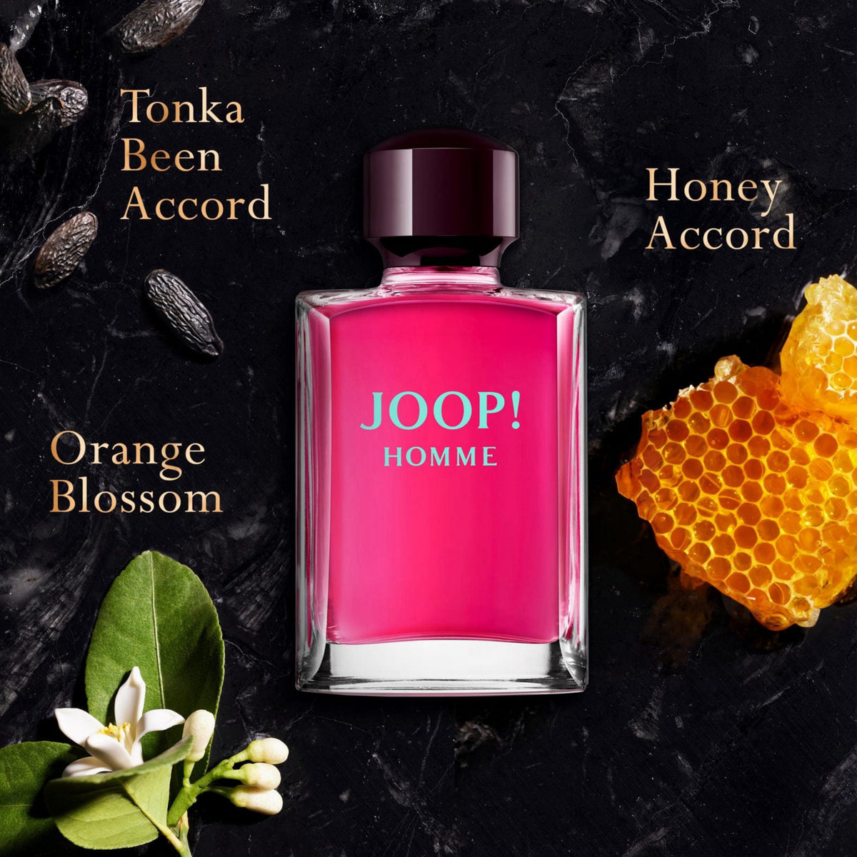 JOOP! Homme perfume bottle with floral and honey elements on a dark background